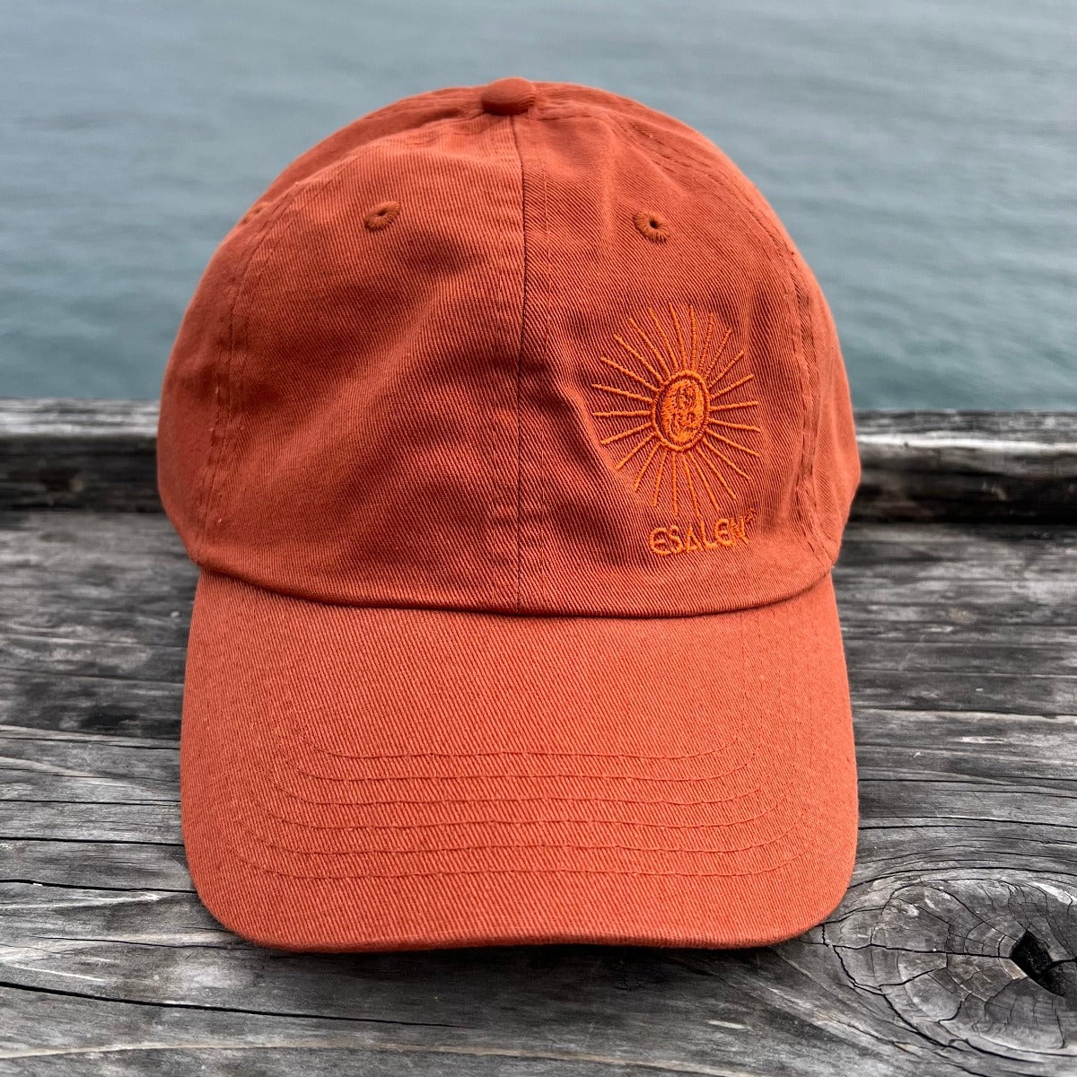 Esalen Sunbeam Logo Baseball Hat in Burnt Orange