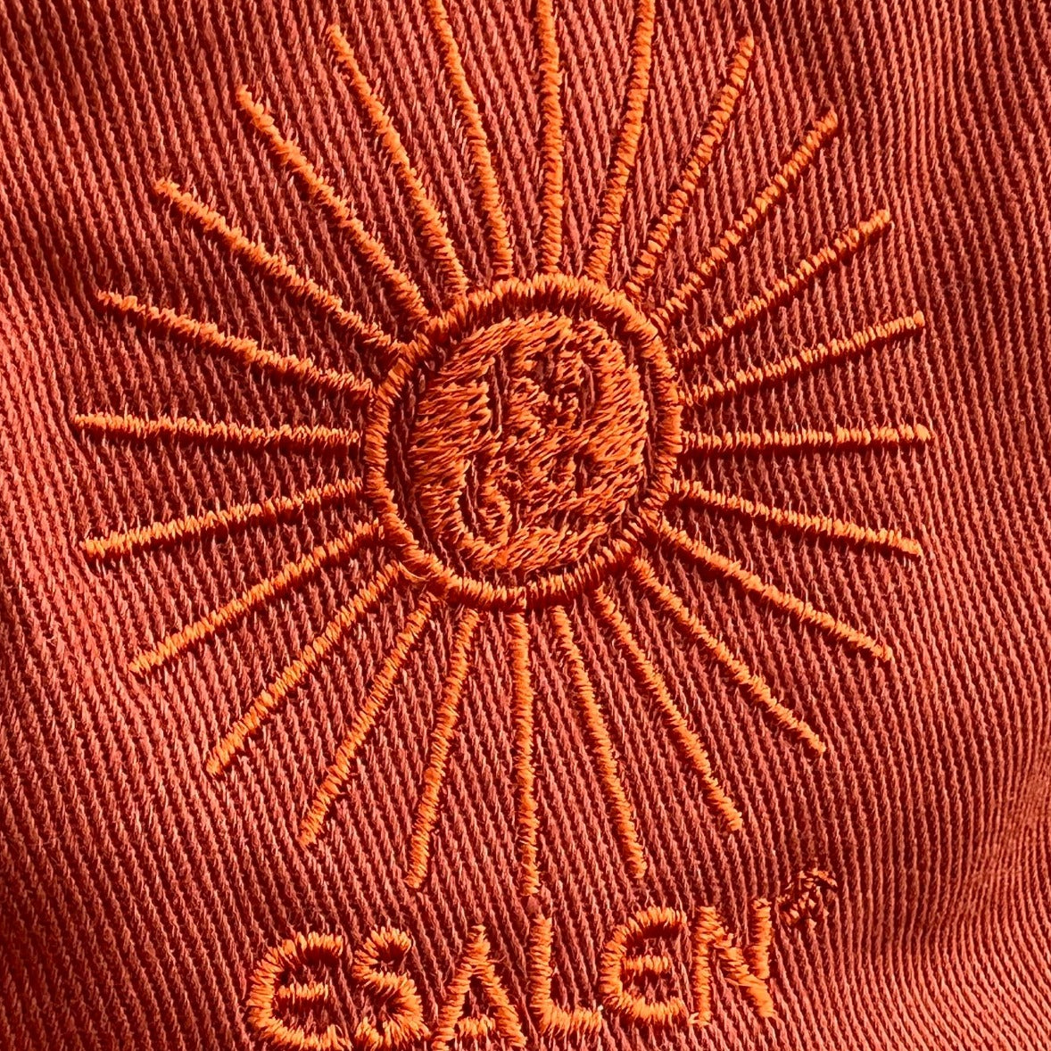Esalen Sunbeam Logo Baseball Hat in Burnt Orange