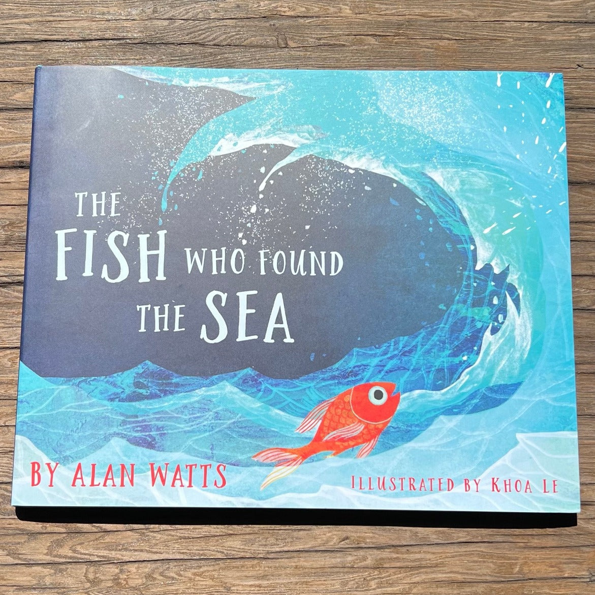 Esalen Children's Books The Fish Who Found The Sea by Alan Watts front cover on wood table